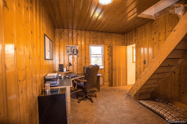 home office with wood ceiling, wooden walls, and carpet