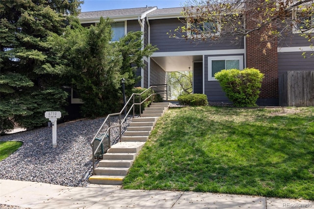 6730 W 84th Cir Unit 96, Arvada, CO 80003 - view of front of home featuring stairs and a front yard