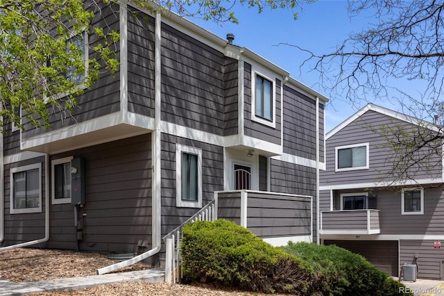 6730 W 84th Cir Unit 96, Arvada, CO 80003 - view of front facade featuring an attached garage and central AC unit