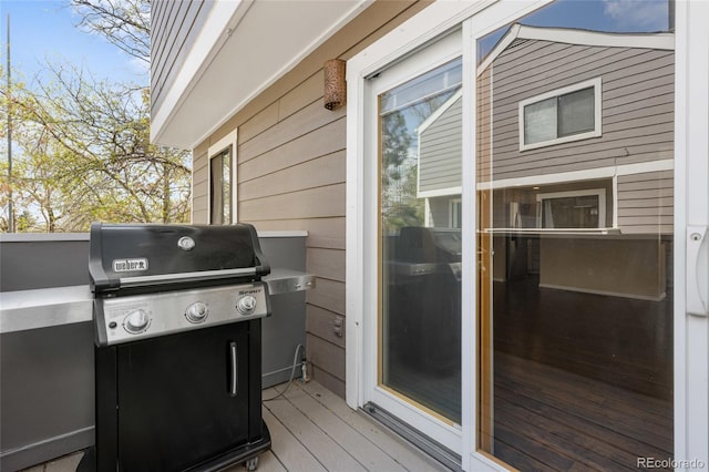 6730 W 84th Cir Unit 96, Arvada, CO 80003 - wooden terrace featuring a grill