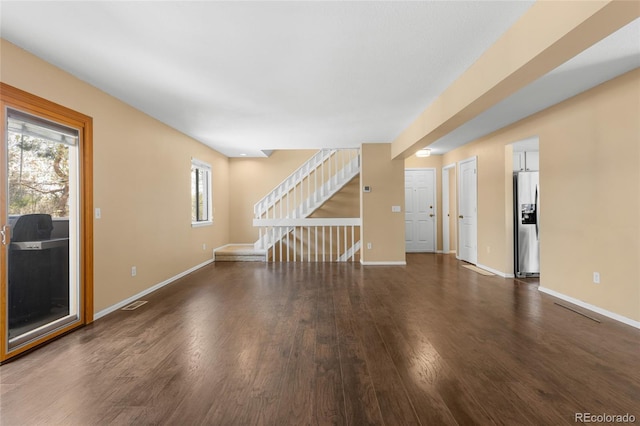 6730 W 84th Cir Unit 96, Arvada, CO 80003 - unfurnished living room featuring stairway, baseboards, and wood finished floors