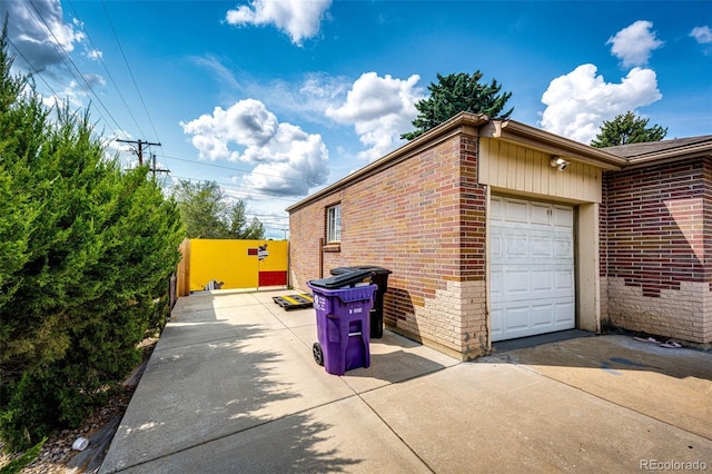 view of side of property with a garage