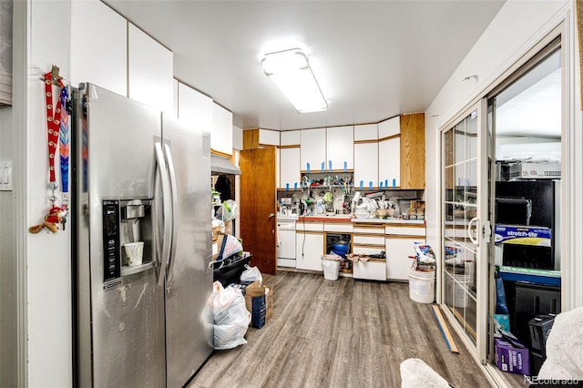 kitchen featuring white cabinetry, hardwood / wood-style floors, and stainless steel fridge with ice dispenser