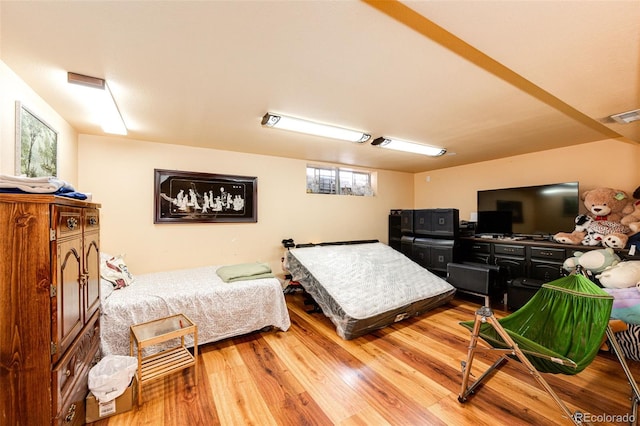 bedroom with wood-type flooring