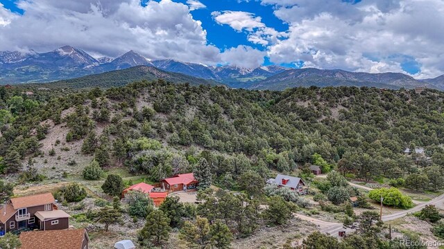 114 Loop Dr, Howard, CO 81233 - aerial view of a mountainous background and a heavily wooded area