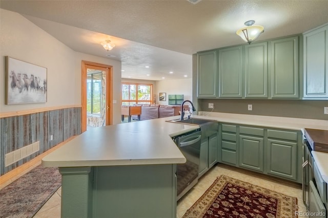 114 Gcr 4624, Grand Lake, CO 80447 - kitchen featuring green cabinetry, stainless steel dishwasher, a peninsula, and a sink