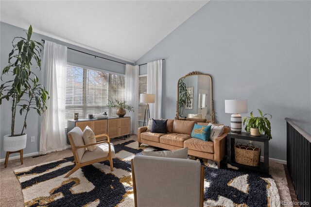 living room featuring baseboards, visible vents, carpet floors, and high vaulted ceiling