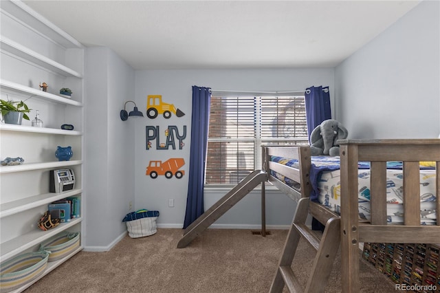 bedroom featuring baseboards and carpet