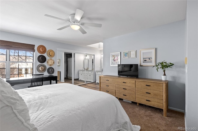 bedroom with dark carpet, baseboards, and a ceiling fan