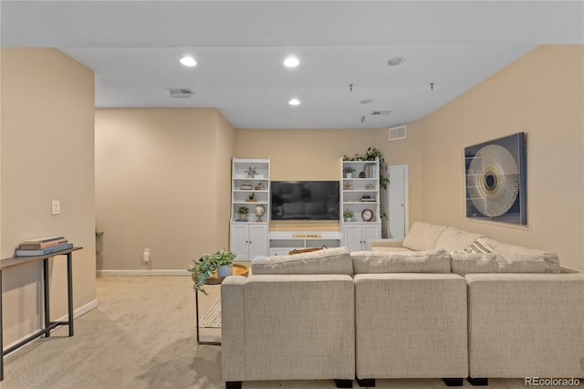 carpeted living area with recessed lighting, visible vents, and baseboards