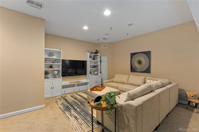 living room featuring baseboards, recessed lighting, visible vents, and light carpet