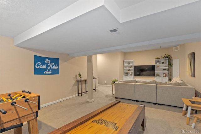 carpeted living room with visible vents and baseboards