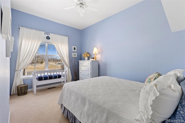 carpeted bedroom with ceiling fan