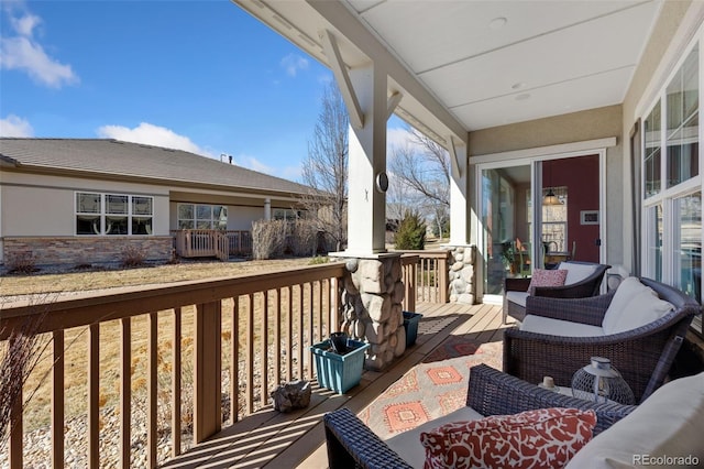 wooden deck featuring an outdoor living space