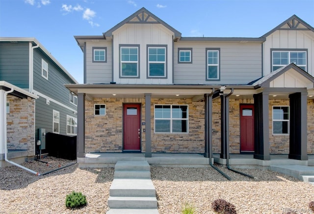22322 E 7th Pl, Aurora, CO 80018 - craftsman-style house with board and batten siding, covered porch, and stone siding