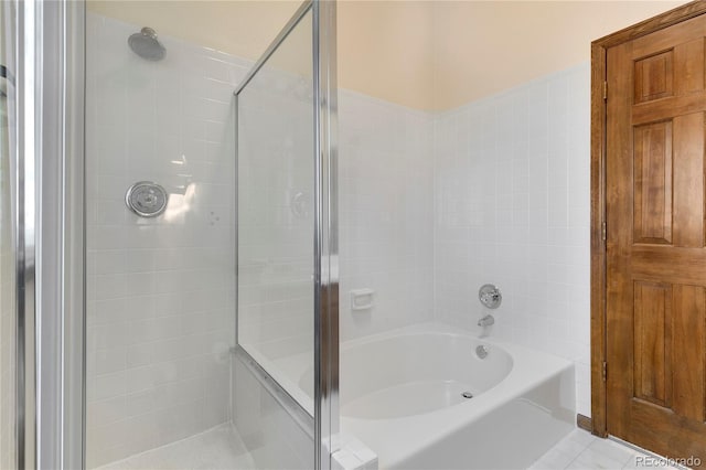 bathroom featuring tile patterned flooring and plus walk in shower