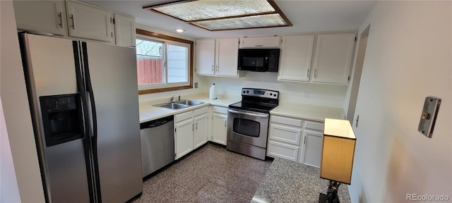 kitchen with white cabinets, stainless steel appliances, and sink