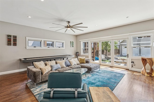 living area featuring baseboards, a ceiling fan, recessed lighting, and wood finished floors