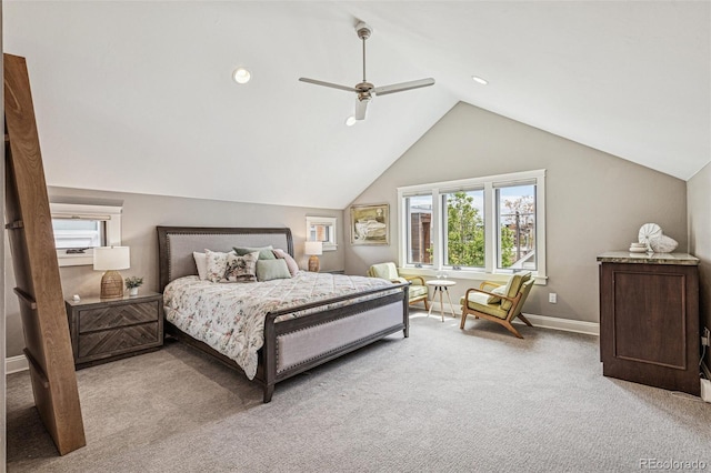 bedroom with baseboards, multiple windows, vaulted ceiling, and light colored carpet