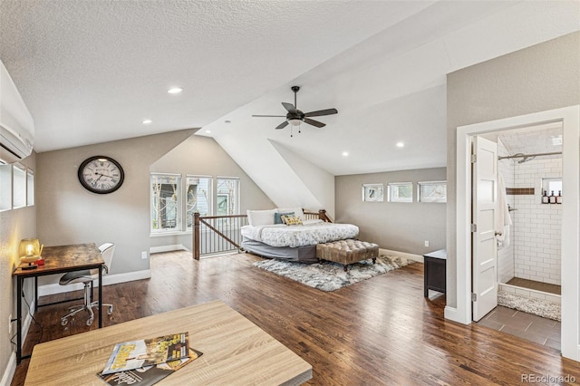 bedroom with multiple windows, vaulted ceiling, and wood finished floors