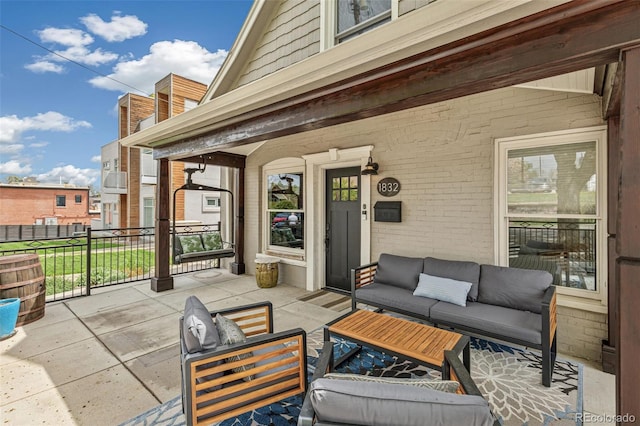 view of patio featuring a porch and outdoor lounge area