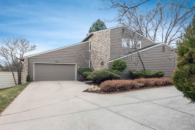 view of home's exterior featuring an attached garage and concrete driveway