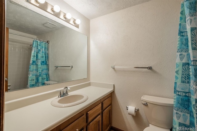 bathroom with visible vents, toilet, and a textured wall