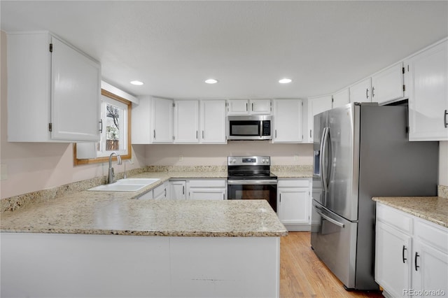 5603 S Pagosa Ct, Centennial, CO 80015 - kitchen with light stone countertops, recessed lighting, white cabinets, a sink, and stainless steel appliances