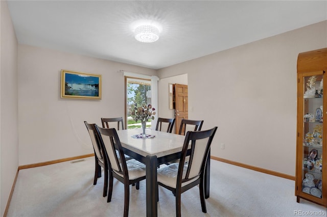 5603 S Pagosa Ct, Centennial, CO 80015 - dining area with light colored carpet, baseboards, a chandelier, and visible vents