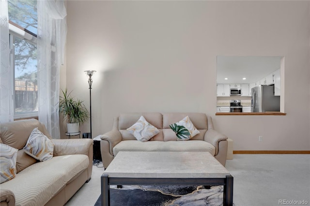 5603 S Pagosa Ct, Centennial, CO 80015 - living area with recessed lighting, baseboards, and light colored carpet