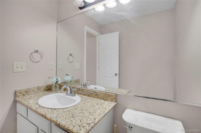 5603 S Pagosa Ct, Centennial, CO 80015 - half bath featuring vanity and toilet