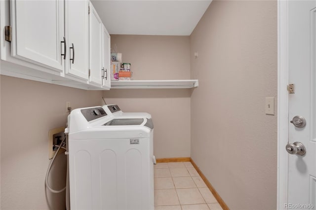5603 S Pagosa Ct, Centennial, CO 80015 - clothes washing area featuring cabinet space, baseboards, washing machine and dryer, and light tile patterned floors