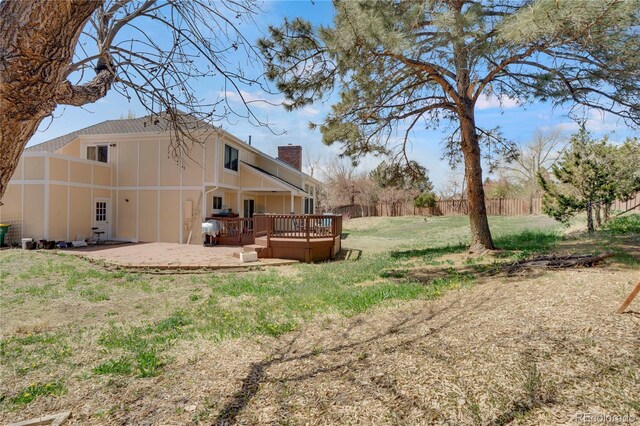 5603 S Pagosa Ct, Centennial, CO 80015 - view of yard featuring fence, a wooden deck, and a patio area