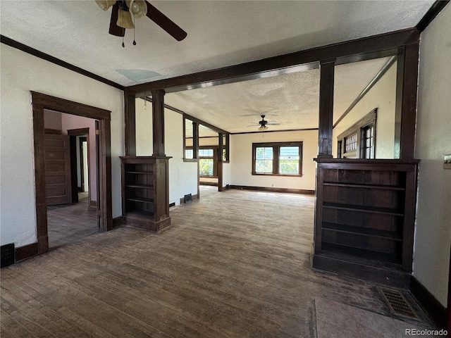 interior space featuring hardwood / wood-style flooring, a textured ceiling, and ceiling fan