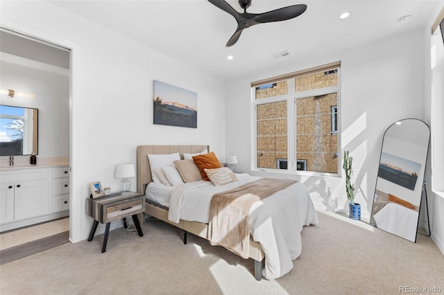 1232 N Yates St Unit 3, Denver, CO 80204 - bedroom with light carpet, recessed lighting, ceiling fan, and connected bathroom