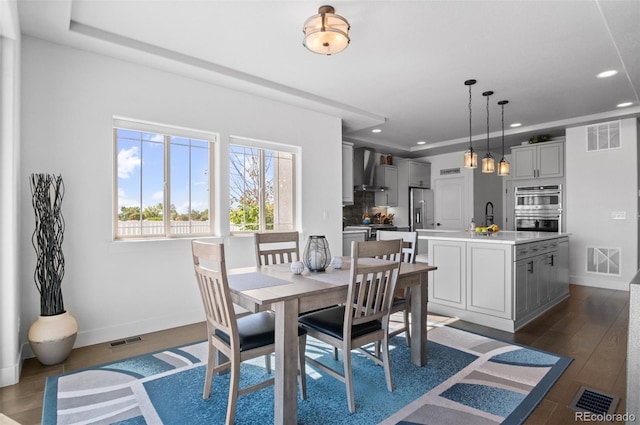 dining space with visible vents, recessed lighting, and dark wood-style flooring