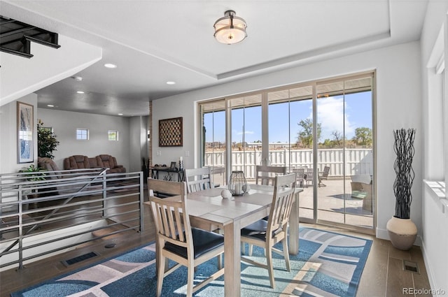 dining area featuring recessed lighting, visible vents, baseboards, and wood finished floors