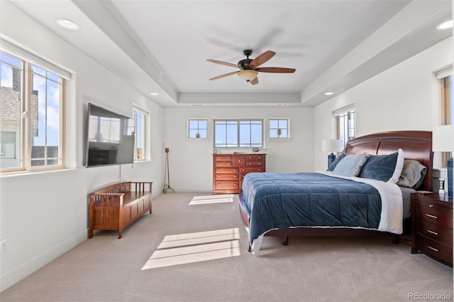 carpeted bedroom featuring recessed lighting, a ceiling fan, a raised ceiling, and baseboards