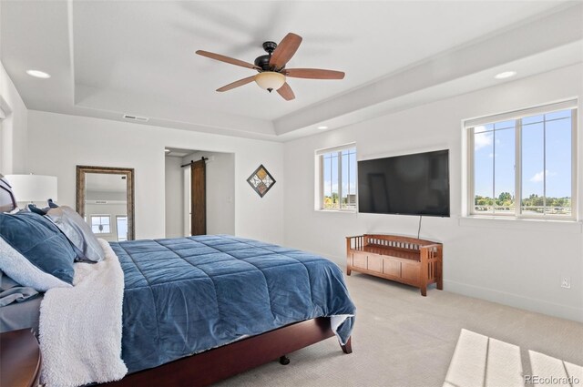 bedroom featuring visible vents, baseboards, light carpet, recessed lighting, and a raised ceiling