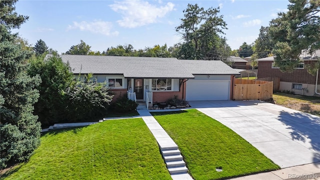 ranch-style home with a front yard and a garage