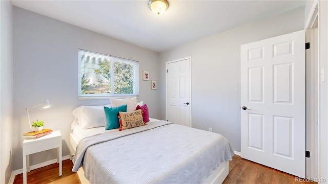 bedroom featuring hardwood / wood-style flooring