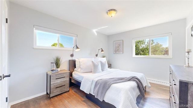 bedroom featuring dark hardwood / wood-style flooring