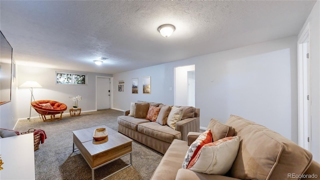 living room with light carpet and a textured ceiling