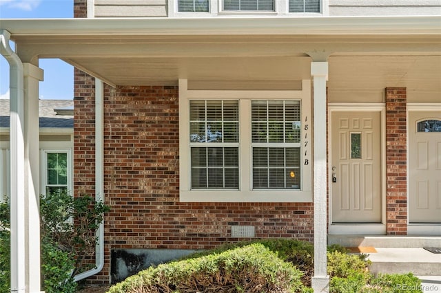 18171 E Arizona Ave Unit B, Aurora, CO 80017 - entrance to property featuring brick siding and covered porch