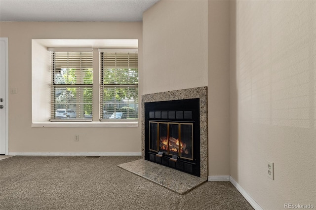 18171 E Arizona Ave Unit B, Aurora, CO 80017 - detailed view of carpet floors, a fireplace with flush hearth, and baseboards