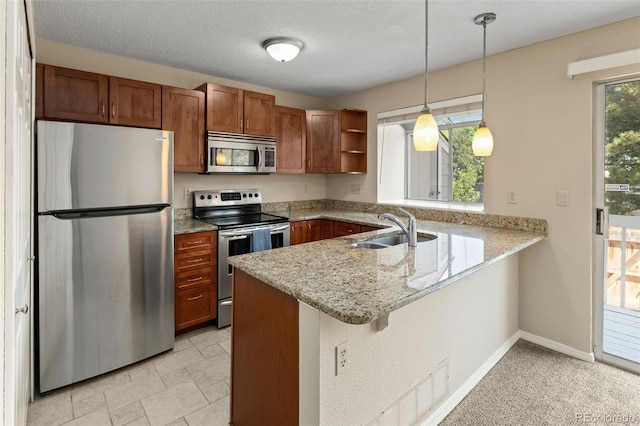 18171 E Arizona Ave Unit B, Aurora, CO 80017 - kitchen featuring appliances with stainless steel finishes, a sink, a peninsula, open shelves, and hanging light fixtures