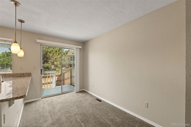 18171 E Arizona Ave Unit B, Aurora, CO 80017 - spare room with carpet, a textured ceiling, and baseboards
