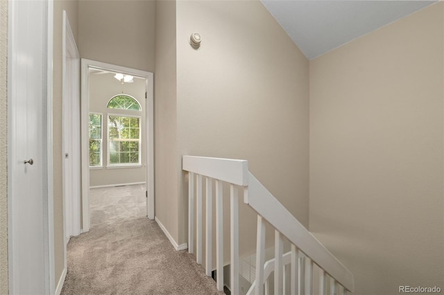18171 E Arizona Ave Unit B, Aurora, CO 80017 - corridor featuring an upstairs landing, carpet floors, and vaulted ceiling