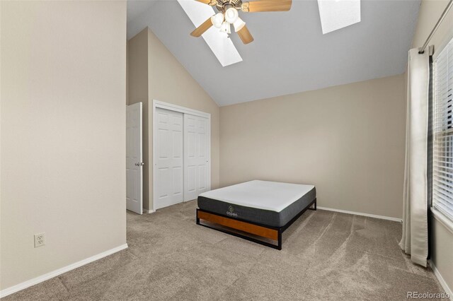 18171 E Arizona Ave Unit B, Aurora, CO 80017 - carpeted bedroom with a skylight, baseboards, high vaulted ceiling, a closet, and ceiling fan