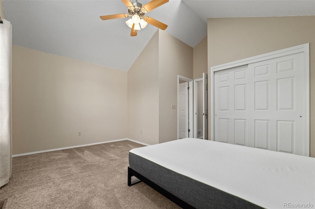 18171 E Arizona Ave Unit B, Aurora, CO 80017 - bedroom featuring carpet floors, lofted ceiling, baseboards, a closet, and ceiling fan